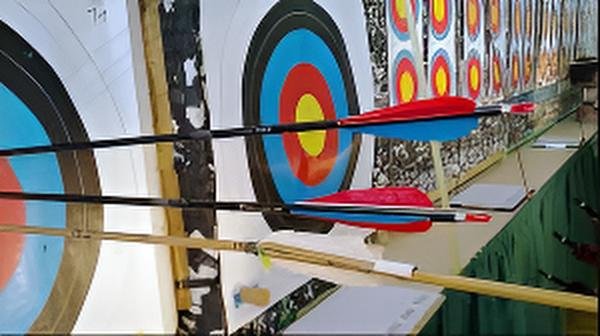Archers take aim during the daily Shillong Teer game at Polo Ground, a tradition blending sport and chance in Meghalaya.