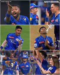 Mumbai Indians captain Hardik Pandya celebrates with teammates after a win.