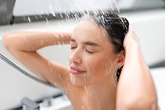 Dermatologists say rising temperatures, sweat, and pollution increase scalp buildup, making frequent, gentle hair washing essential in summer.