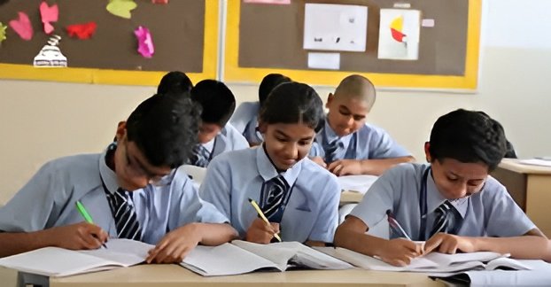 A focused student revising with organised notes in a calm study space while preparing confidently for exams.