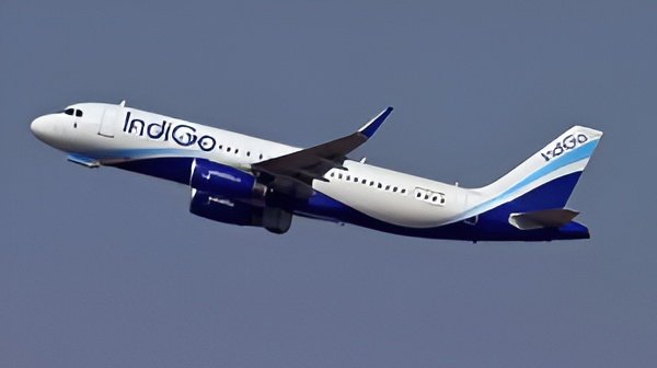 An IndiGo aircraft grounded amid widespread flight cancellations, highlighting the airline’s recent operational and regulatory challenges.