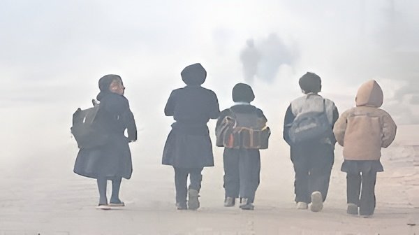 Students walk through foggy winter mornings as Uttar Pradesh considers extended school holidays amid cold wave conditions.