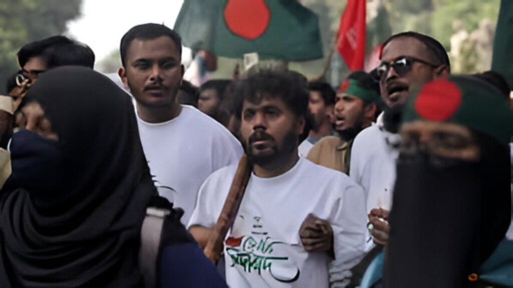 Supporters hold posters of student leader Sharif Osman Hadi during a protest in Dhaka demanding justice.