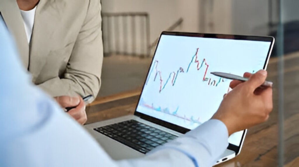 Traders monitor screens at the National Stock Exchange as markets prepare for a muted opening.