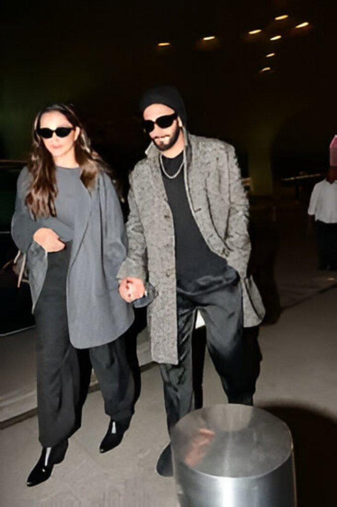 Ranveer Singh at Mumbai airport with Deepika Padukone after Dhurandhar’s blockbuster success.