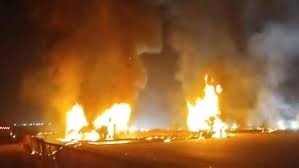 Luxury sleeper bus engulfed in flames after a truck collision on NH48 near Hiriyur, Chitradurga district, Karnataka.