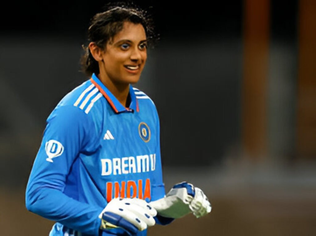 Smriti Mandhana celebrates her record-breaking innings after surpassing 1,700 runs in the 2025 calendar year for India.