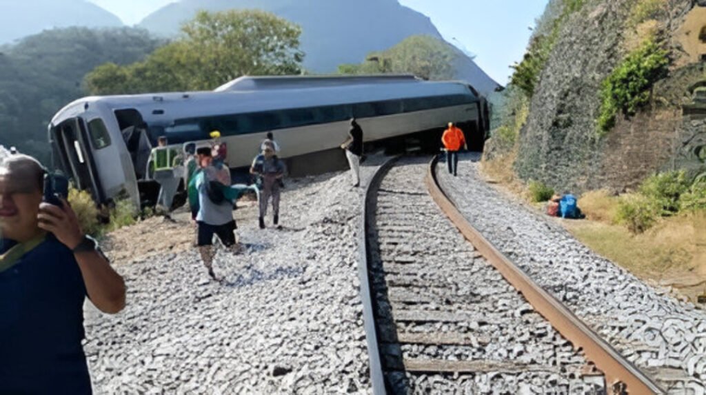 Rescue workers assist passengers after the Interoceanic train derailed near Nizanda, Oaxaca, Mexico, causing multiple fatalities and injuries.