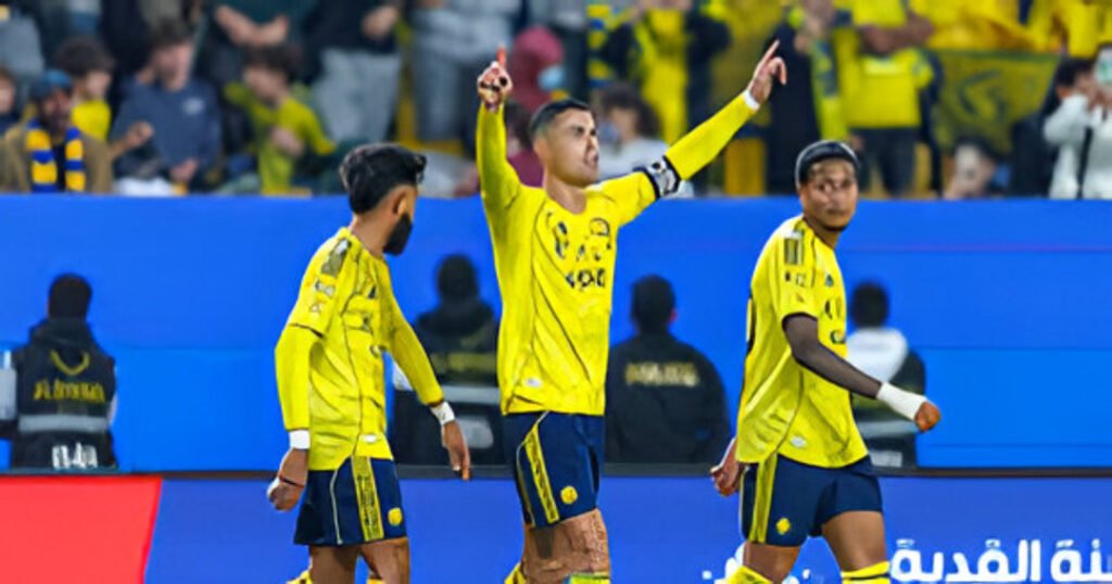 Cristiano Ronaldo celebrates after scoring a brace for Al-Nassr in the Saudi Pro League, breaking Lionel Messi’s historic goal-scoring record.