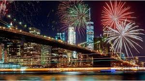Fireworks light up New York City skyline as crowds gather at Central Park, Brooklyn Bridge Park, and Times Square to welcome 2026.