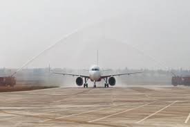 An Air India aircraft receives a ceremonial water salute during the successful trial run at Bhogapuram International Greenfield Airport.