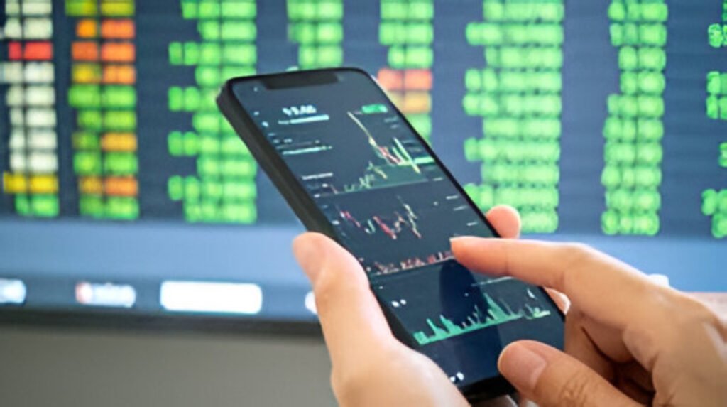 Traders watch market screens as Sensex and Nifty recover sharply after early losses in Mumbai.