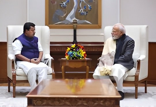 Prime Minister Narendra Modi congratulates newly elected BJP National President Nitin Nabin during his swearing-in ceremony at the party headquarters in New Delhi.