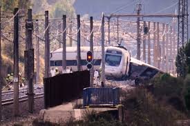 Emergency crews inspect the wreckage of a derailed commuter train near Gélida in Catalonia following severe weather conditions.