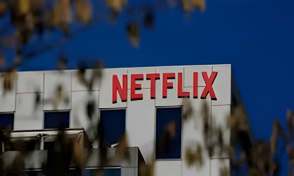 Netflix shares fall after mixed results and slowing subscriber growth amid Warner Bros takeover fight.