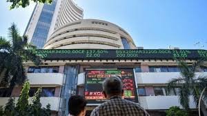 Traders track screens on Dalal Street as Indian markets react to Budget buzz, earnings updates and global economic signals.