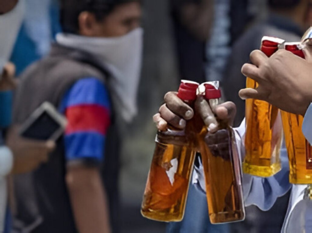 Crowds at liquor outlets in Hyderabad as Telangana witnesses record-breaking alcohol sales ahead of New Year celebrations.
