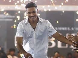 Dhanush receiving Tamil Nadu State Best Actor Award for Vada Chennai at Kalaivanar Arangam.