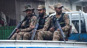 Pakistani security forces at the site of militant attacks in Balochistan, ensuring civilian safety and restoring order.